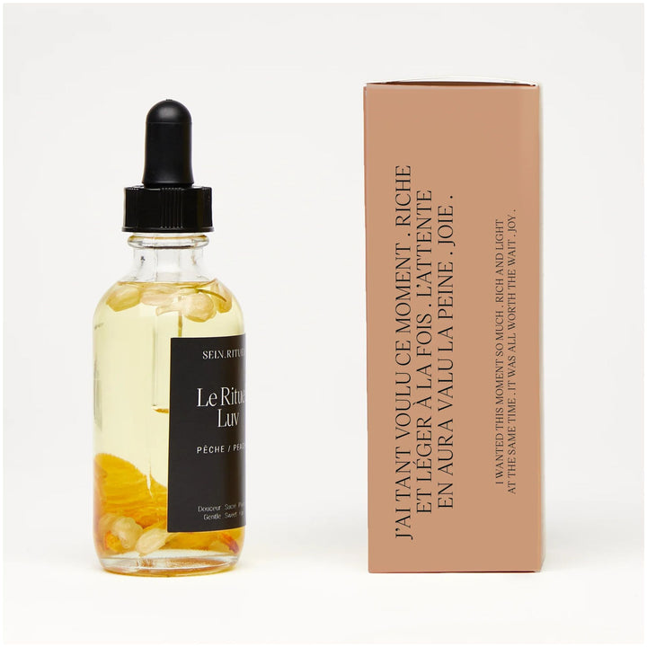 SELV Rituel LUV peach Botanical Bath & Body Oil with bottle and gift packaging side view