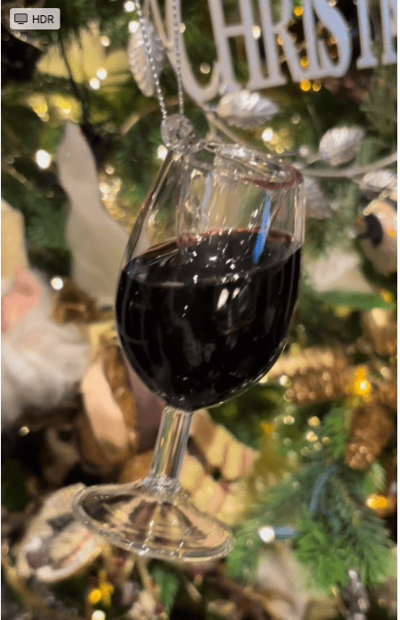 WINE GLASS ORNAMENT FILLED WITH LIQUID THAT LOOKS LIKE MERLOT