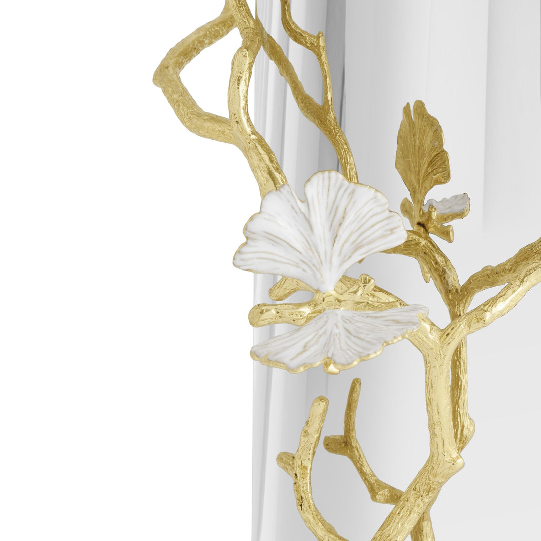 Close-up of a Michael Aram Butterfly Ginkgo Gold Vase showing sculpted goldtone ginkgo branches and textured white enamel leaf accents resembling butterflies against the reflective silver-tone body.