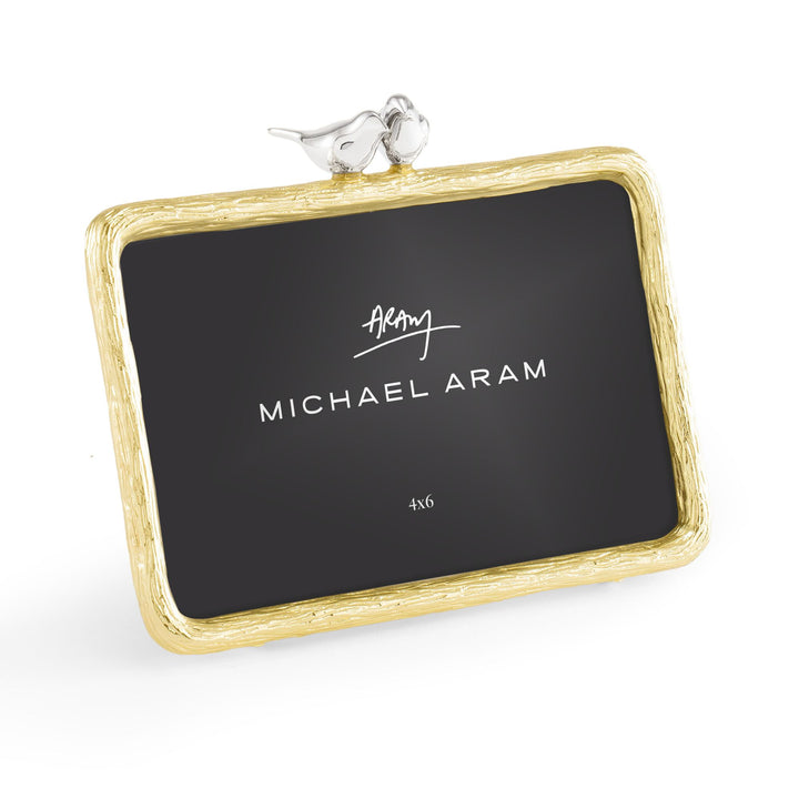 Right-angle view of Michael Aram Lovebirds 4x6 picture frame showing the textured gold-tone frame and sculpted silver-tone lovebirds projecting above the frame