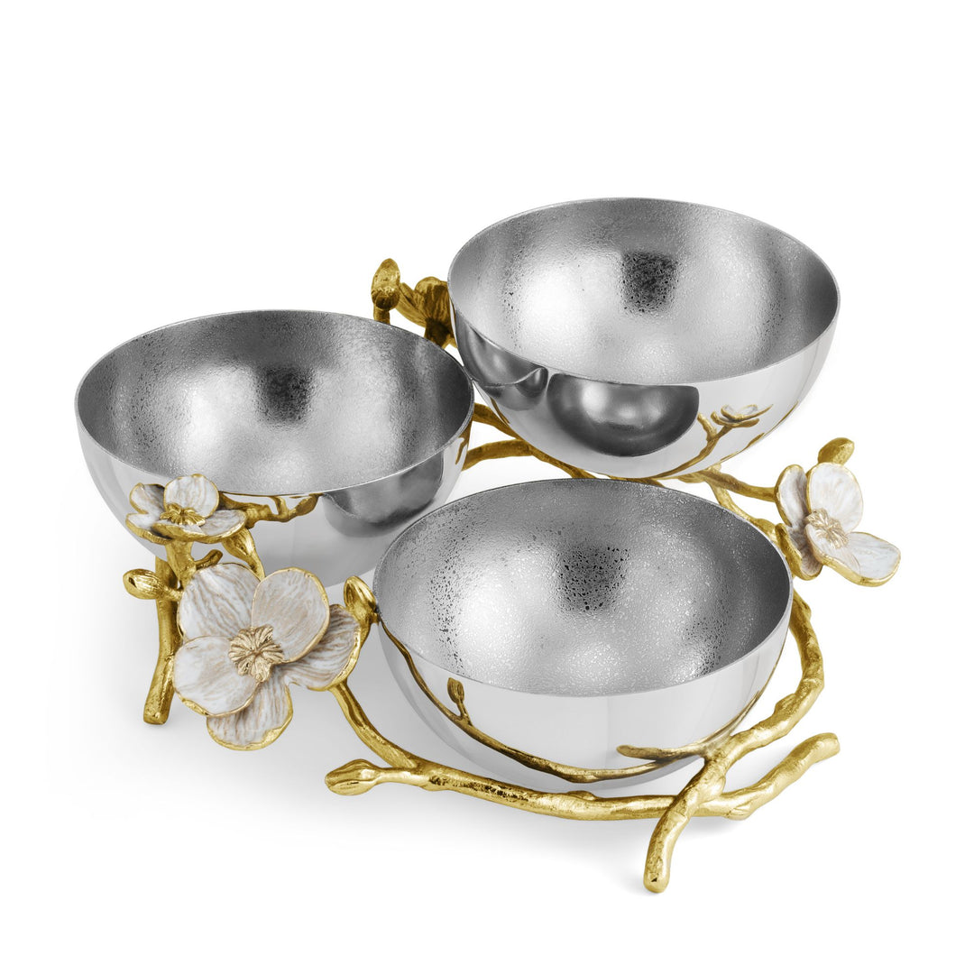 Michael Aram Orchid Triple Low Bowl with three metallic silver bowls, textured inside and polished outside, arranged at varying heights on a dimensional goldtone branch base with white enamel orchid flowers