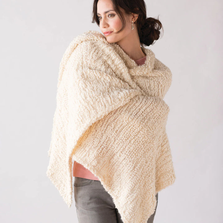 woman wearing cozy giving shawl with pocket