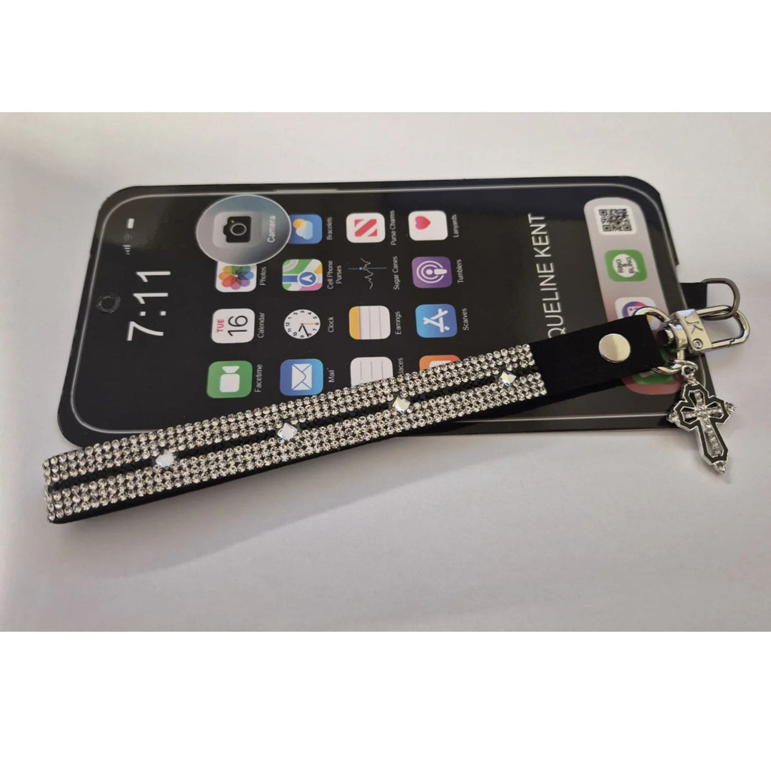 Jacqueline Kent black faux leather phone wrist strap with silver rhinestones and a silver cross charm, 
