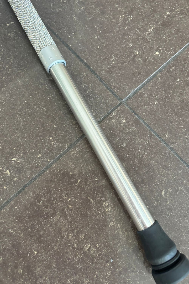 Jacqueline Kent  rhinestone walking cane close up, extended to show the adjustable silver shaft and rubber tip