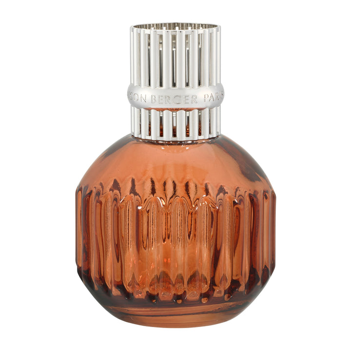 Lampe Berger Cannelo Paprika coloured home fragrance lamp in warm amber-orange fluted glass with a silver-coloured slotted diffuser top.
