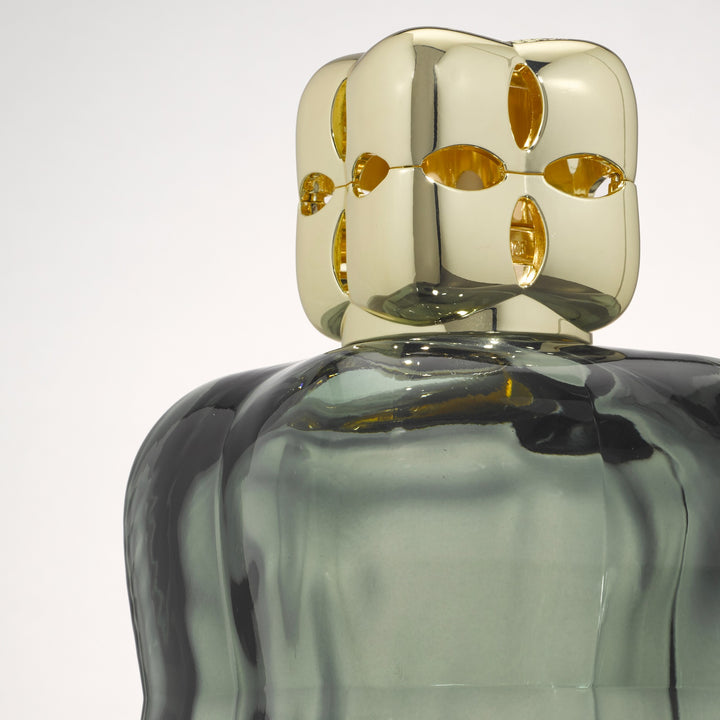 Lampe Berger Cosy Green home fragrance lamp viewed from above, showing the unique gold-coloured diffuser cap and rounded green glass shoulders.

