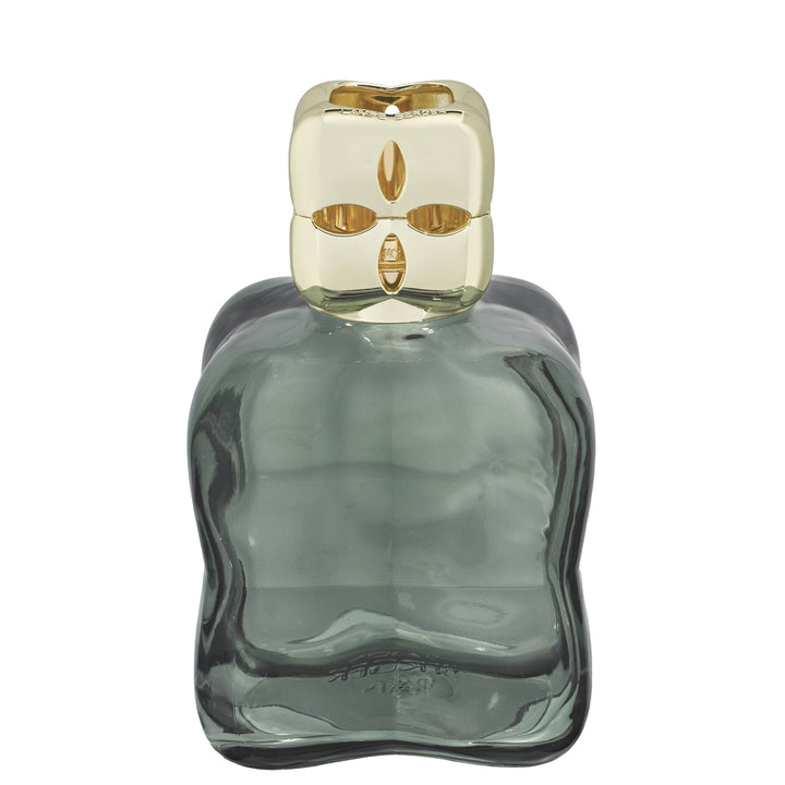 Lampe Berger Cosy Green home fragrance lamp in sculpted green glass with a gold-coloured diffuser cap and oval cut-outs.
