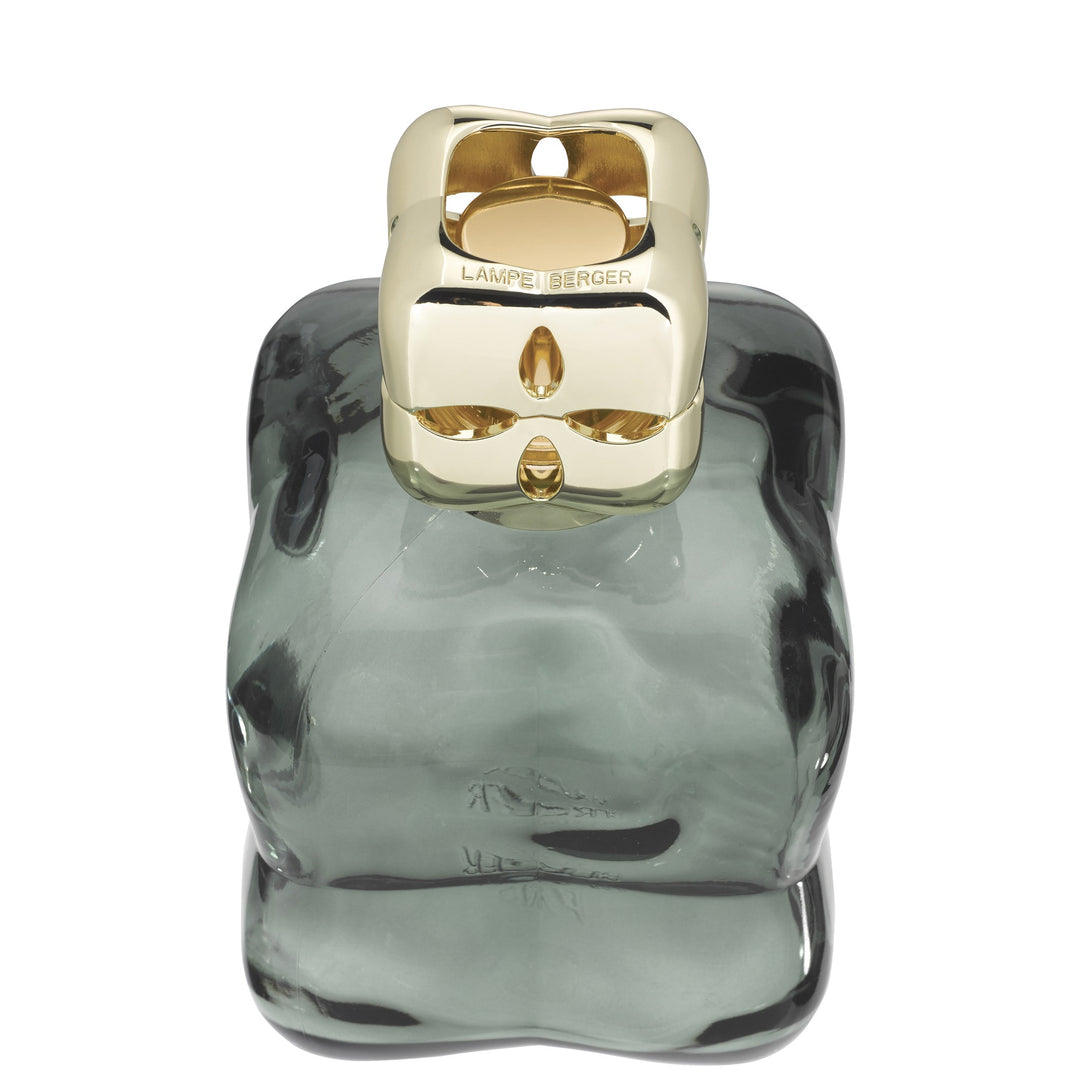 Lampe Berger Cosy Green home fragrance lamp viewed from above, showing the gold-coloured diffuser cap and rounded green glass shoulders.
