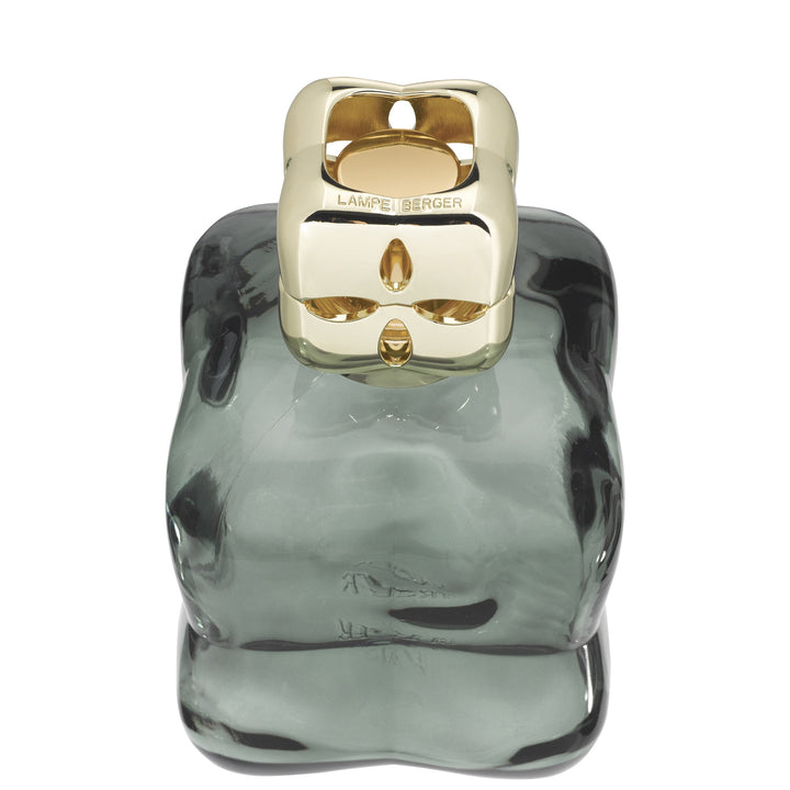 Lampe Berger Cosy Green home fragrance lamp viewed from above, showing the gold-coloured diffuser cap and rounded green glass shoulders.

