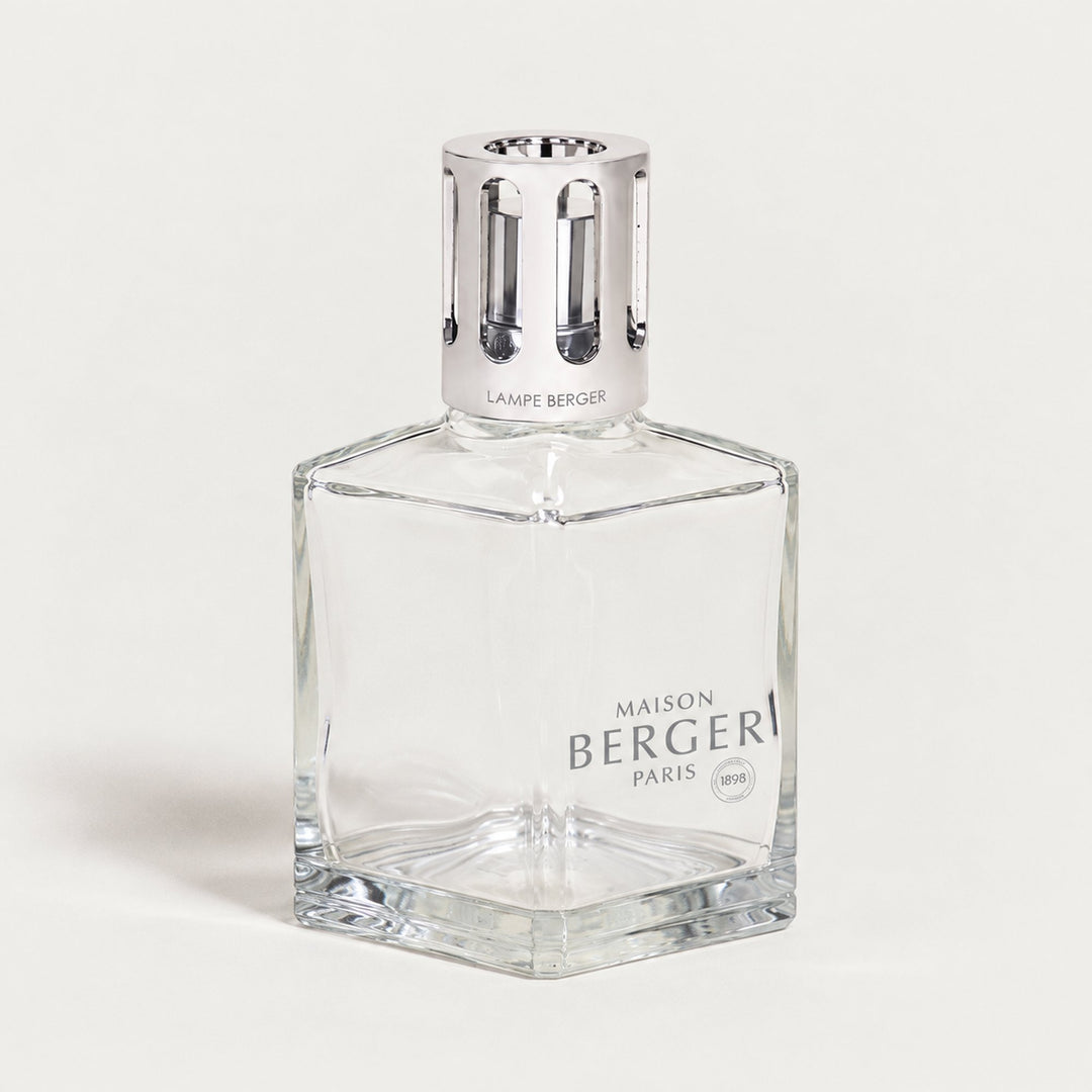 Lampe Berger Essential Square home fragrance lamp with a clear geometric glass body, thick bevelled base, Maison Berger Paris logo and tall polished silver slotted diffuser cap