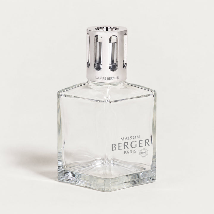 Lampe Berger Essential Square home fragrance lamp with a clear geometric glass body, thick bevelled base, Maison Berger Paris logo and tall polished silver slotted diffuser cap