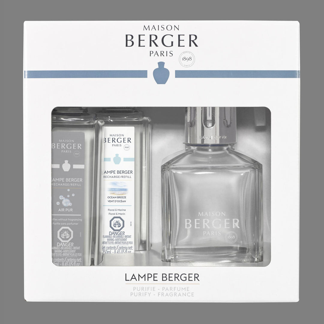Lampe Berger Essential Square clear glass lamp with polished silver slotted diffuser cap, displayed beside 250 ml Ocean Breeze and 250 ml Air Pur So Neutral refill bottles.