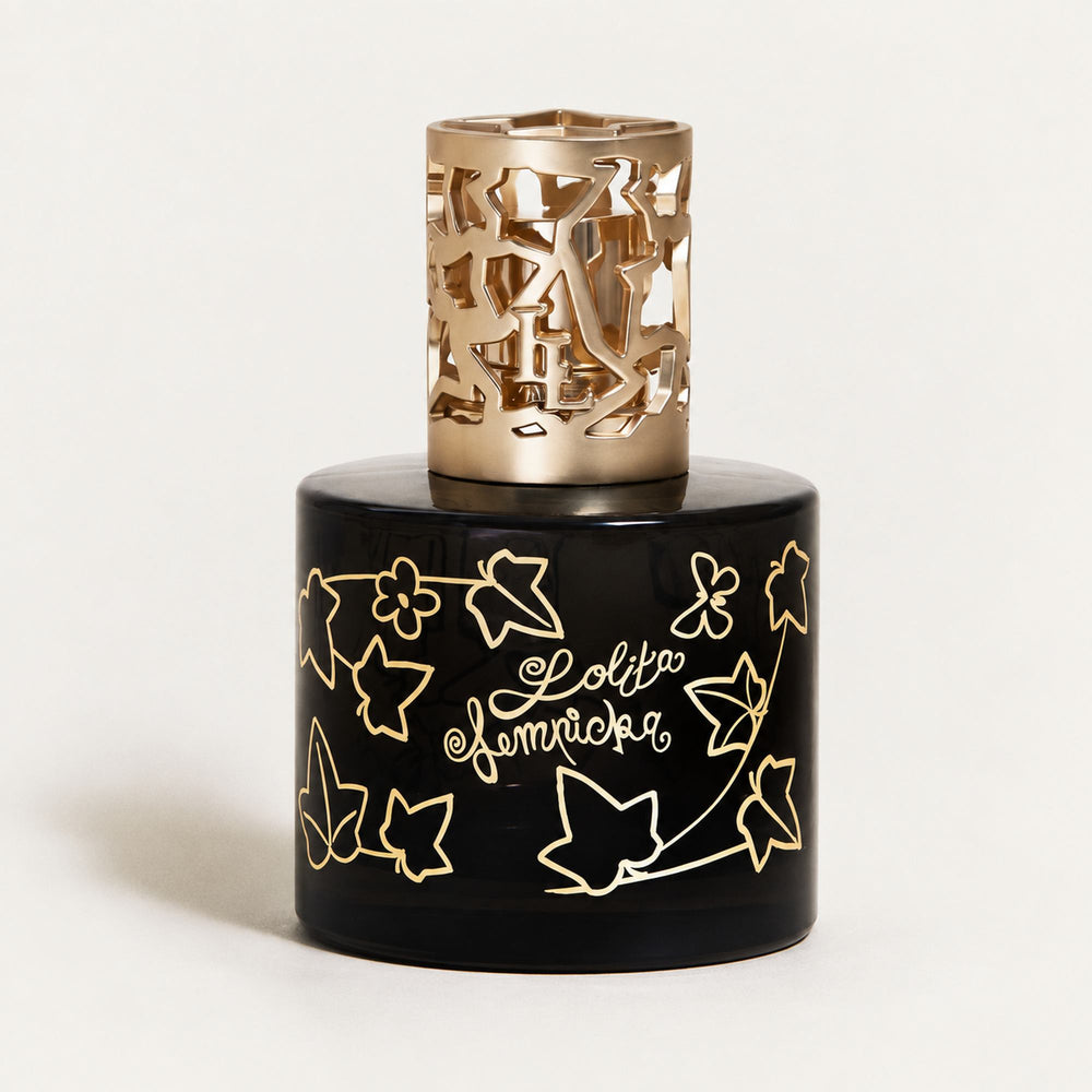 Lampe Berger Lolita Lempicka home fragrance lamp in black glass with gold ivy-leaf decoration and an ornate gold-coloured metal diffuser top.
