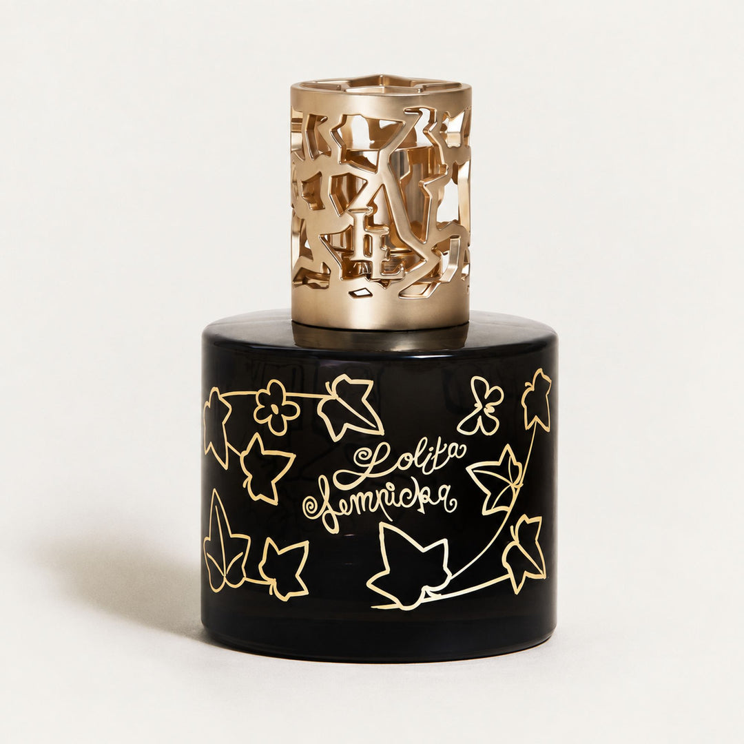 Lampe Berger Lolita Lempicka home fragrance lamp in black glass with gold ivy-leaf decoration and an ornate gold-coloured metal diffuser top.
