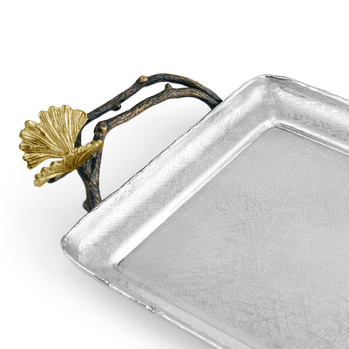 Michael Aram Butterfly Ginkgo decorative Tray handcrafted in hand textured stainless steel with natural and oxidized brass butterfly ginkgo handles. for bedroom, bathroom accessory. Close up