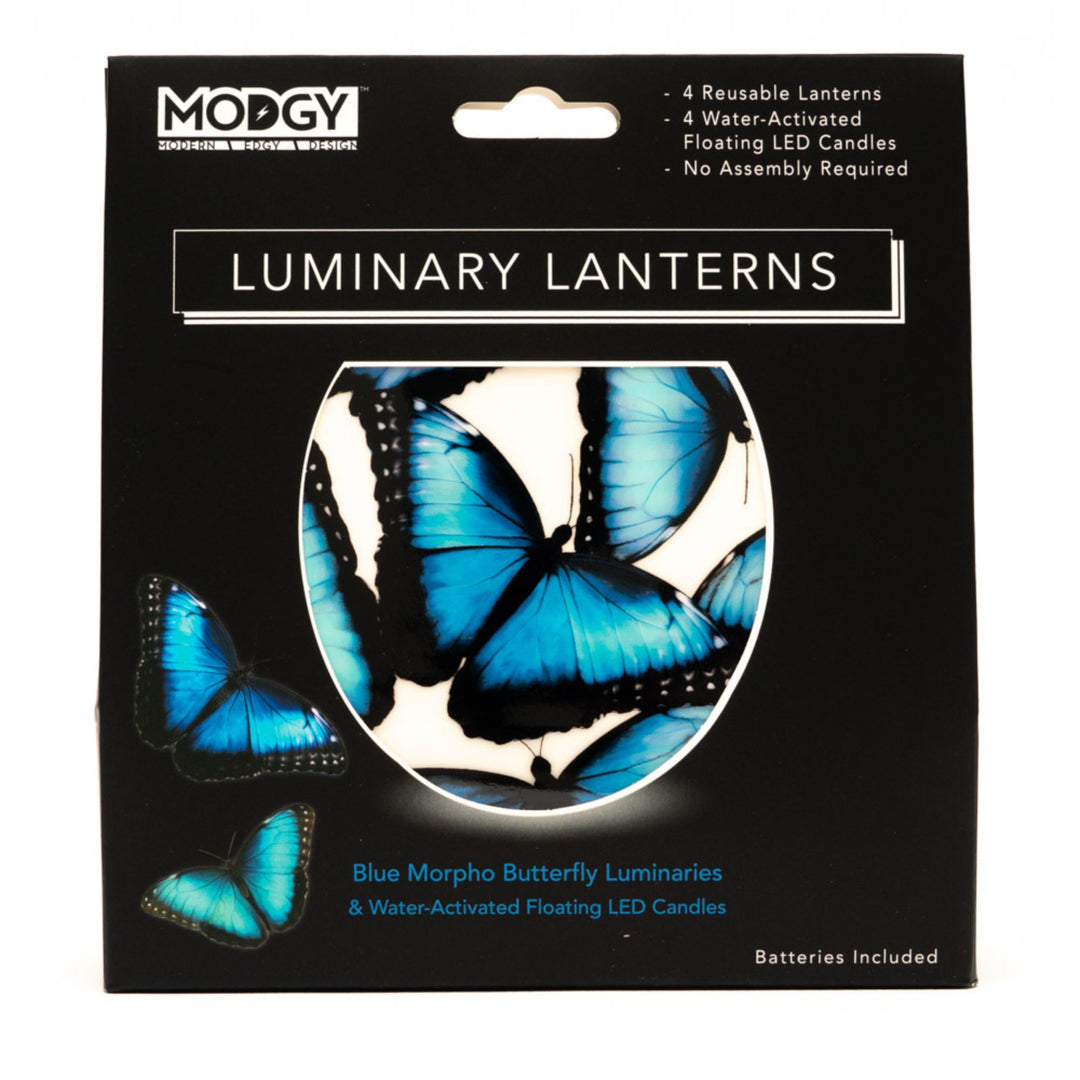 MODGY Blue Morpho Butterfly Luminaries packaging, featuring a black box with blue butterfly graphics and a circular cutout showing the glowing blue lanterns inside.