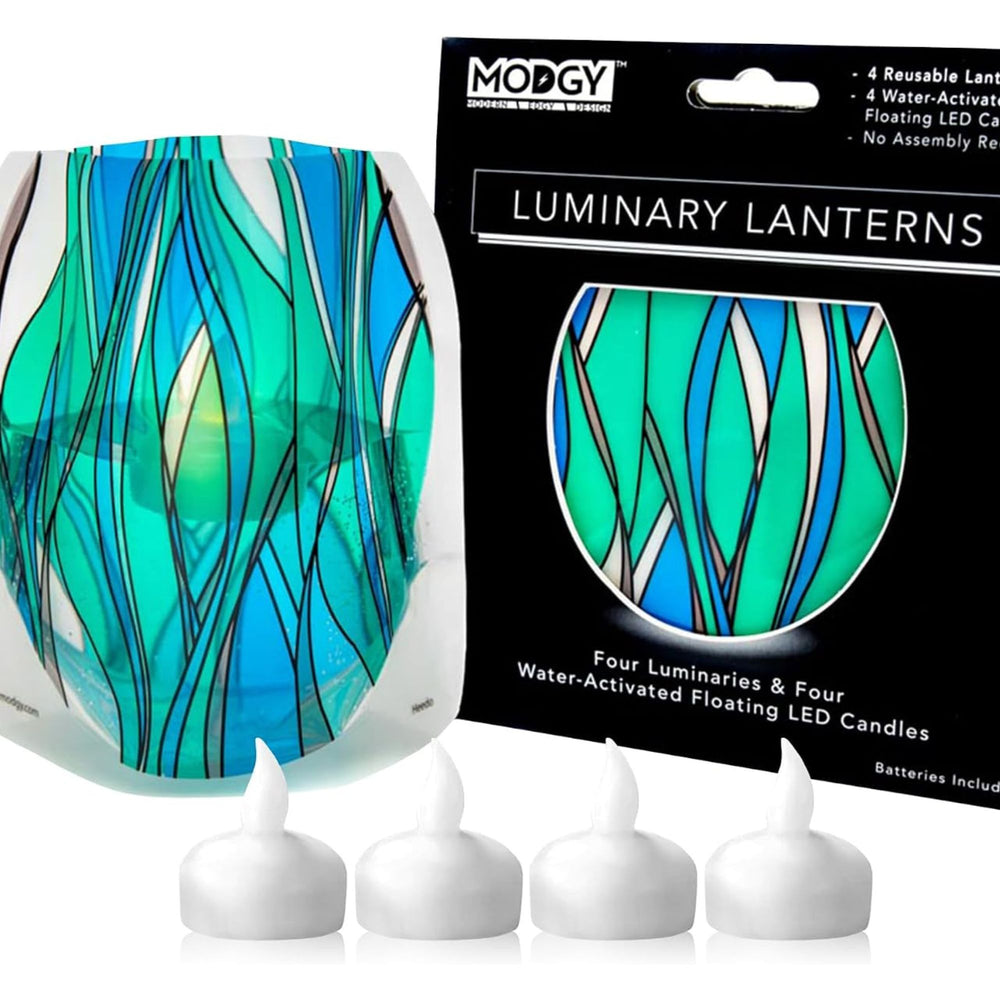 A Modgy reusable luminary HEEDO lantern lantern stained-glass like set featuring blue, green, and black abstract leaf-like lines, four white floating LED candles, and the black gift box packaging.