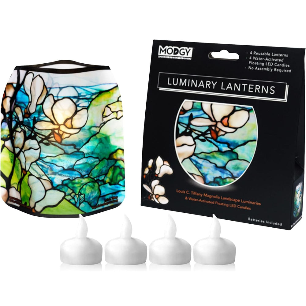 A Modgy Louis C. Tiffany Magnolia Landscape LED luminary lantern shown with its black retail box and 4 LED  water-activated floating candles included