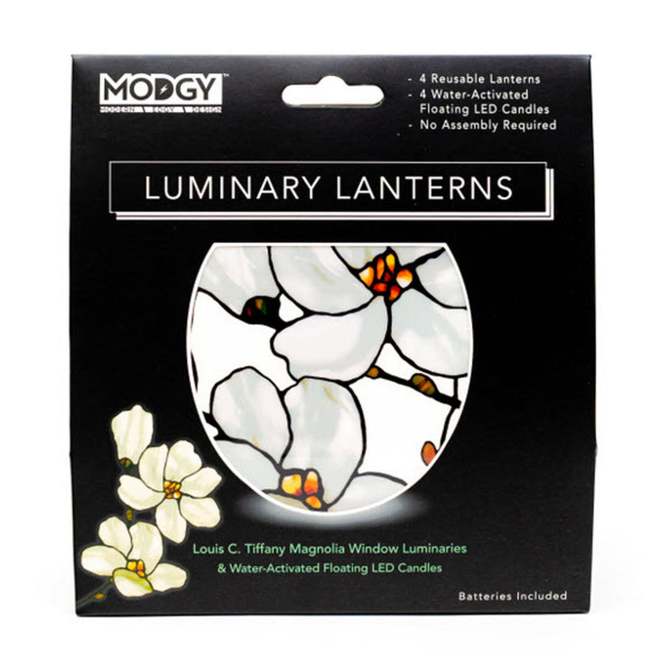 MODGY Louis C. Tiffany Magnolia window luminaries and water-activated floating LED candles in black gift box packaging with a stained-glass-style magnolia illustration.