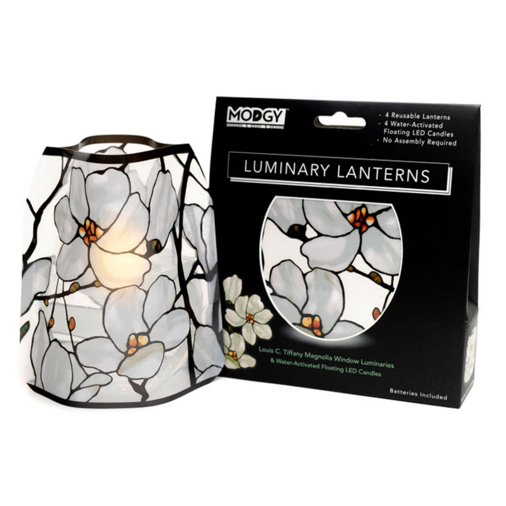 Gift-boxed Modgy LED Luminary Lantern Set of 4 featuring the Tiffany Magnolia Window design inspired by Louis C. Tiffany, including four reusable stained-glass-style luminaries and water-activated floating LED candles.