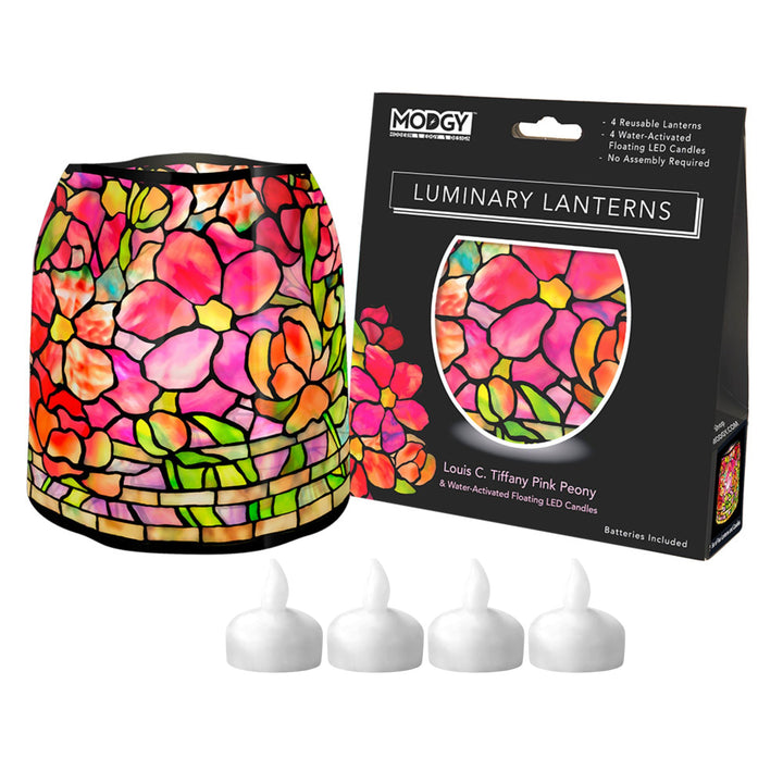 A Modgy Louis C. Tiffany Pink Peony 4-light LED luminary lantern set, featuring a colorful stained-glass-style pink flower lampshade, its black retail packaging box, and four white battery-operated tea light candles on a white background.
