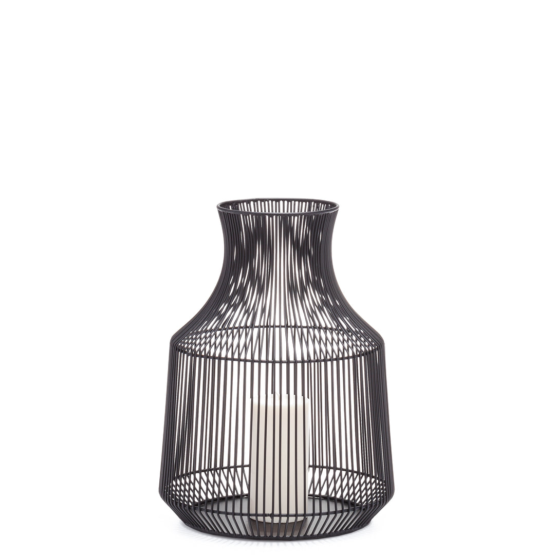 A black metal urn candle holder with a modern geometric pattern.