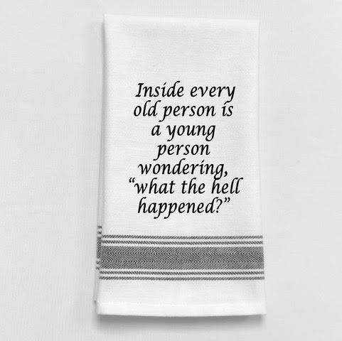 A white cotton tea towel with a humorous quote printed in black text, about the wisdom of old age. Perfect for fun birthday gift giving